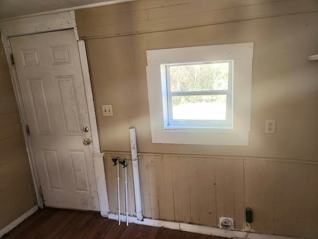 entryway with wooden walls and dark hardwood / wood-style flooring