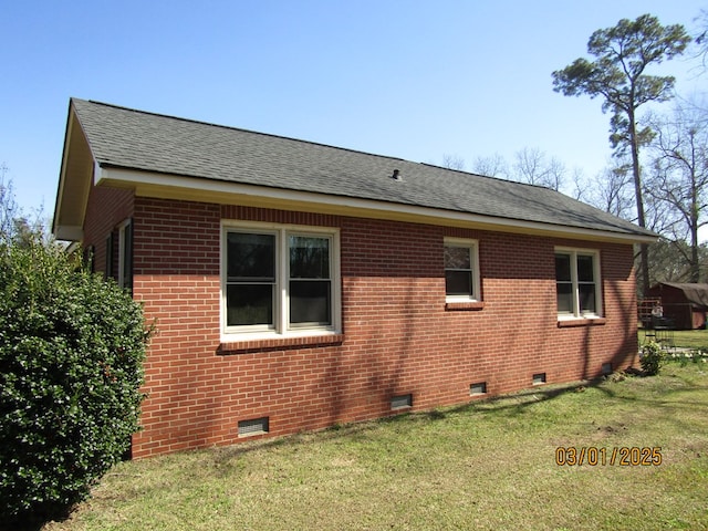 view of property exterior featuring brick siding, crawl space, a shingled roof, and a lawn