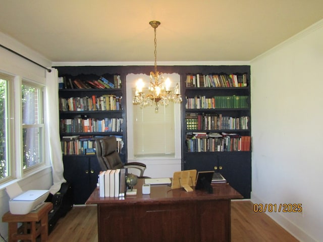 office with crown molding, a notable chandelier, and wood finished floors