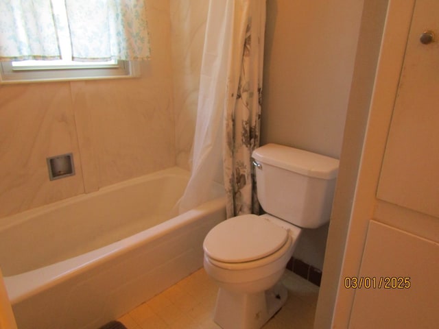 full bath featuring toilet and shower / tub combo with curtain