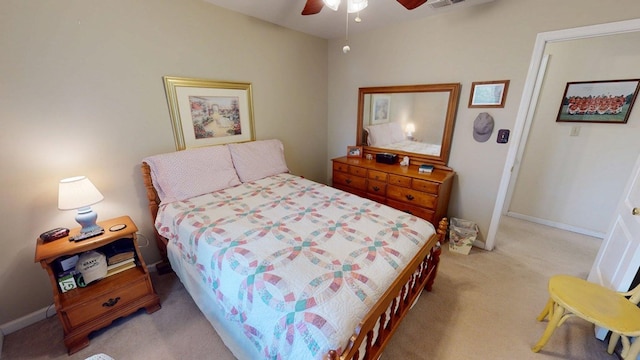 bedroom featuring light colored carpet, baseboards, ceiling fan, and visible vents