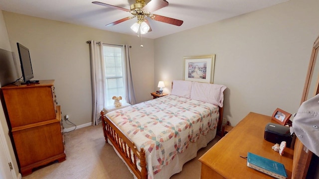 bedroom with light colored carpet and ceiling fan