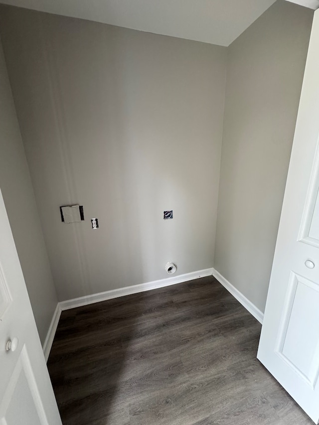 washroom with hookup for an electric dryer, laundry area, baseboards, and dark wood-type flooring