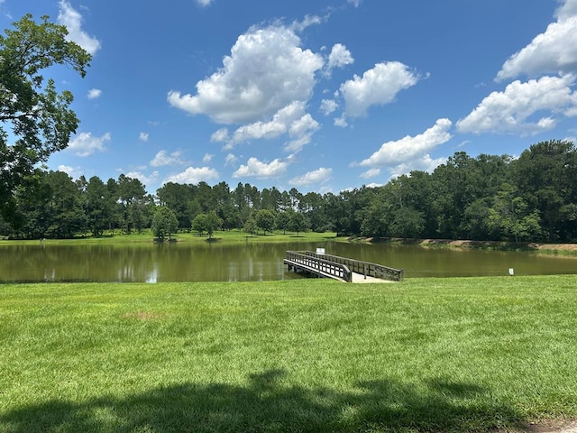 160 Highland St, Thomasville, GA 31792 - dock featuring a water view, a lawn, and a wooded view