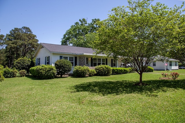 ranch-style house with a front lawn
