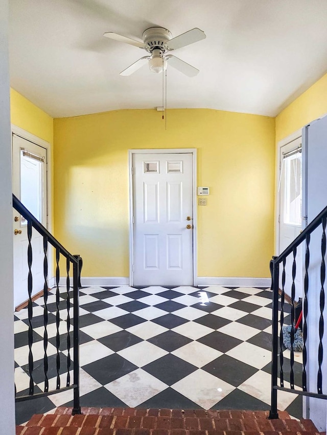 entrance foyer with ceiling fan