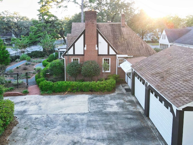 property exterior at dusk with a garage