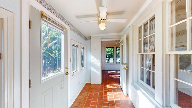 doorway with ceiling fan