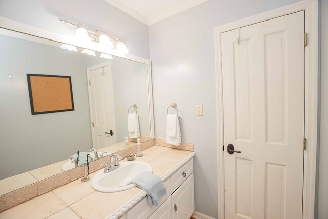 bathroom featuring vanity and crown molding