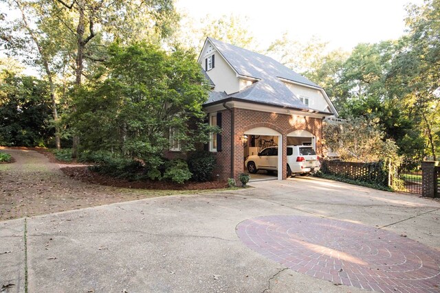 view of property exterior featuring a garage