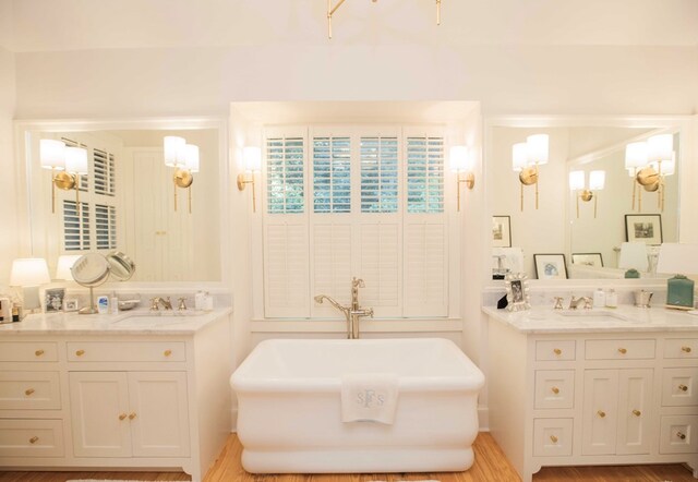 bathroom featuring vanity and a bathtub