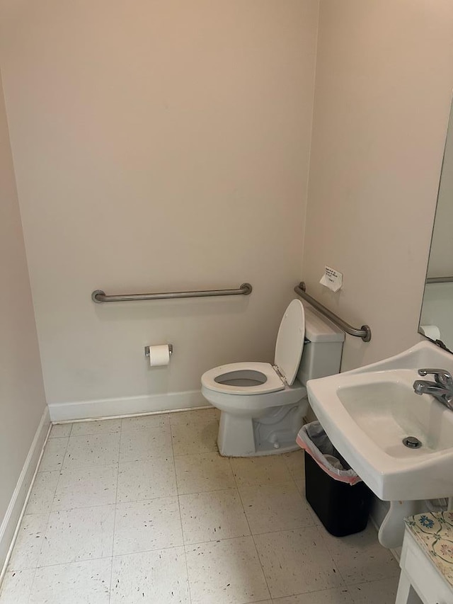 bathroom featuring toilet and sink