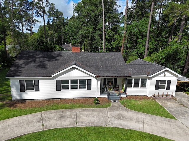 303 Glenwood Dr, Thomasville, GA 31792 - ranch-style home with a porch, roof with shingles, a chimney, and a front yard