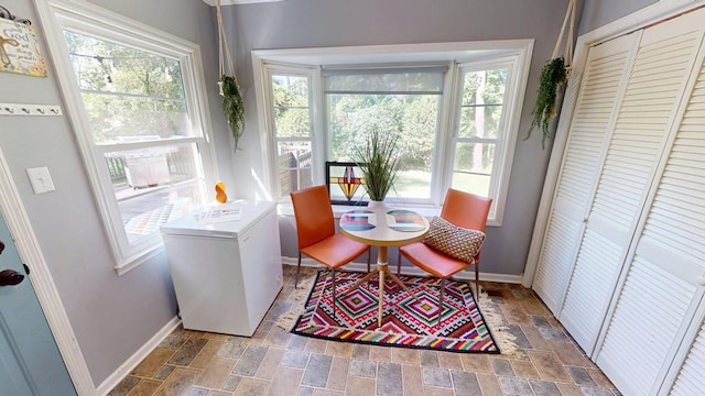 303 Glenwood Dr, Thomasville, GA 31792 - dining space with stone finish floors and healthy amount of natural light
