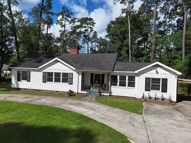 303 Glenwood Dr, Thomasville, GA 31792 - ranch-style home featuring concrete driveway, a porch, a chimney, and a front lawn