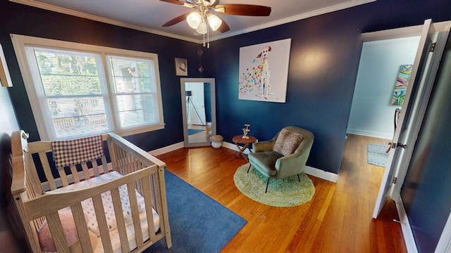 303 Glenwood Dr, Thomasville, GA 31792 - bedroom featuring wood finished floors, ornamental molding, and a ceiling fan