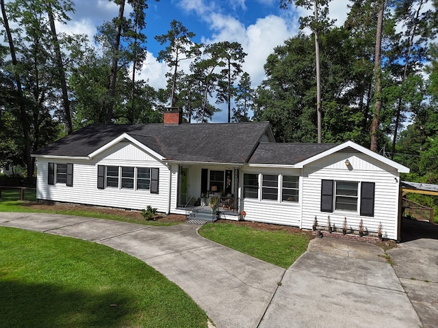 303 Glenwood Dr, Thomasville, GA 31792 - ranch-style house featuring driveway, covered porch, a chimney, and a front yard