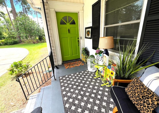 303 Glenwood Dr, Thomasville, GA 31792 - view of exterior entry featuring covered porch and a yard