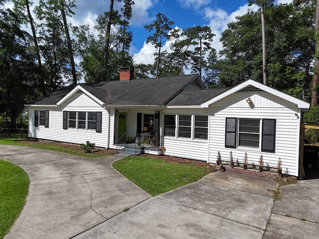 303 Glenwood Dr, Thomasville, GA 31792 - single story home featuring a chimney, driveway, roof with shingles, and a front yard