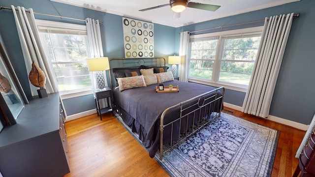303 Glenwood Dr, Thomasville, GA 31792 - bedroom with wood finished floors and ceiling fan