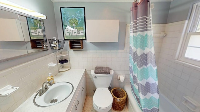 303 Glenwood Dr, Thomasville, GA 31792 - bathroom featuring tile walls, vanity, shower / bathtub combination with curtain, tile patterned floors, and a wainscoted wall