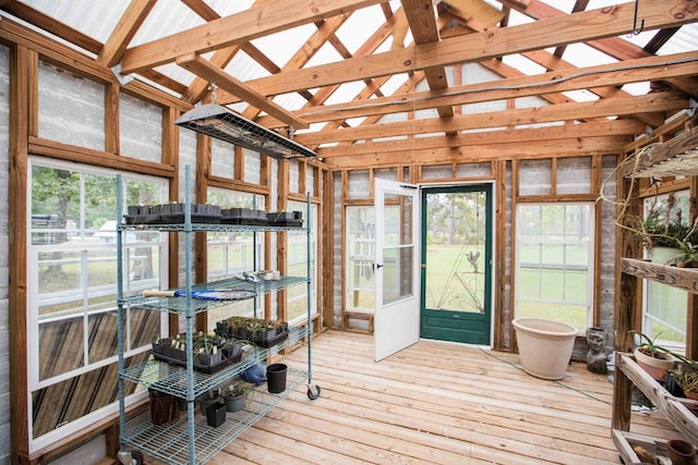 sunroom featuring lofted ceiling