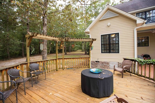 wooden deck featuring a pergola