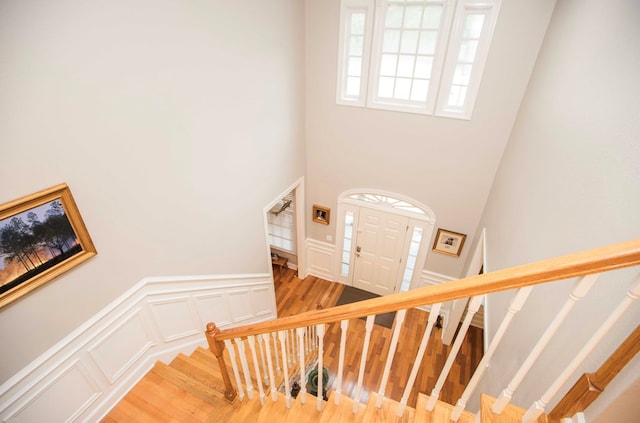 stairs featuring wood-type flooring