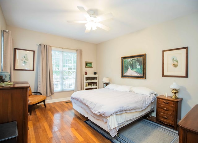 bedroom featuring wood-type flooring and ceiling fan