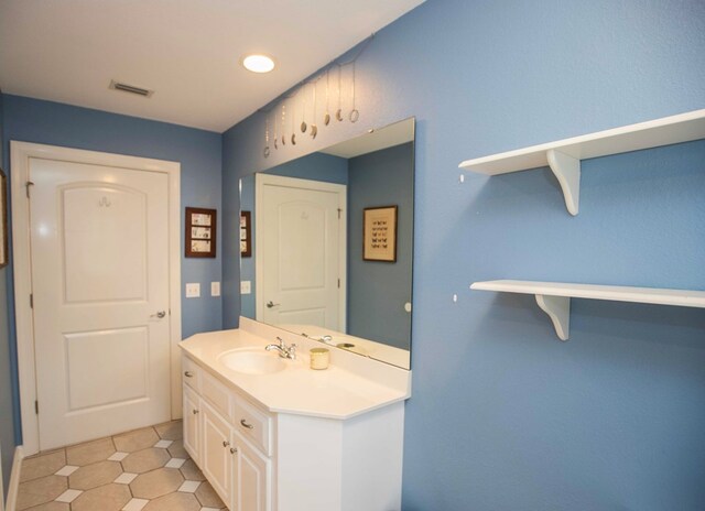 bathroom featuring vanity and tile patterned flooring