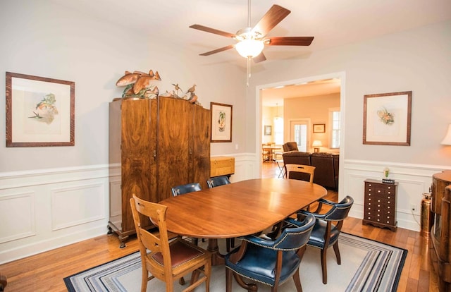 dining area featuring hardwood / wood-style floors and ceiling fan