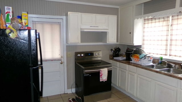 47 Morningside Dr, Camilla, GA 31730 - kitchen with electric range, freestanding refrigerator, under cabinet range hood, a sink, and light tile patterned floors