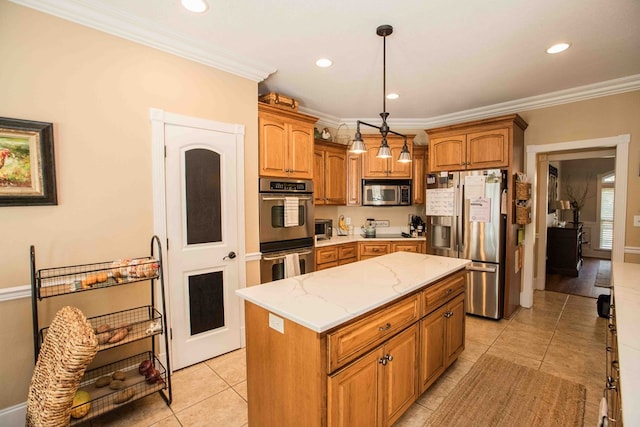 kitchen featuring hanging light fixtures, a kitchen island, ornamental molding, and appliances with stainless steel finishes