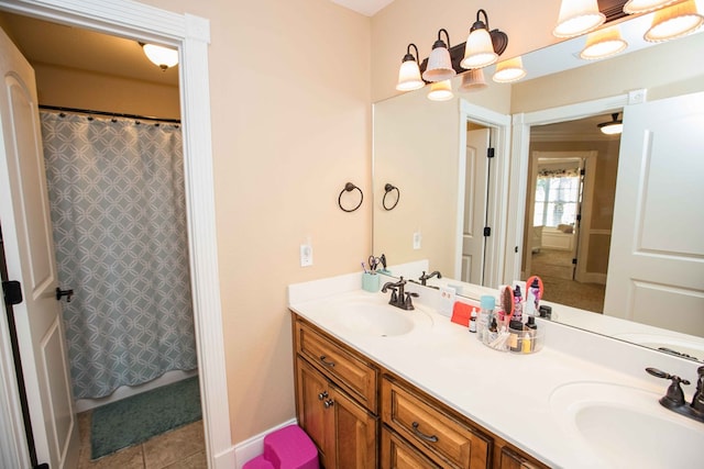 bathroom featuring vanity, tile patterned floors, and a shower with curtain