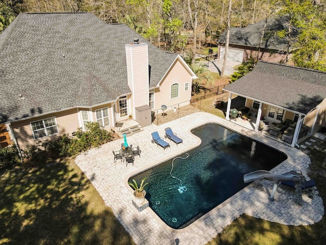 view of swimming pool featuring a patio