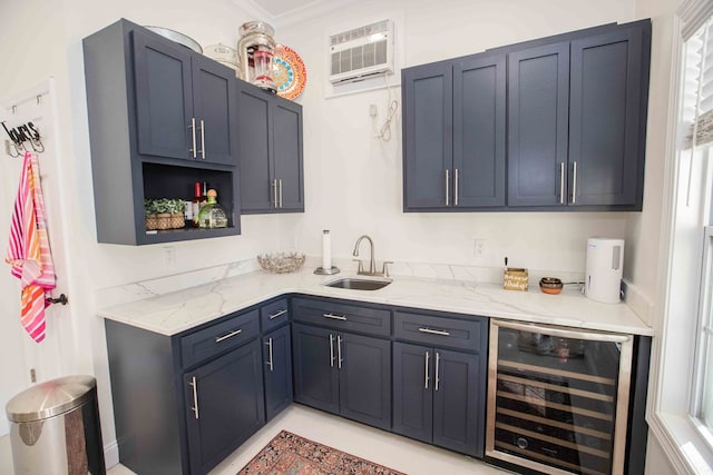 kitchen featuring beverage cooler, light stone countertops, sink, and a wall unit AC