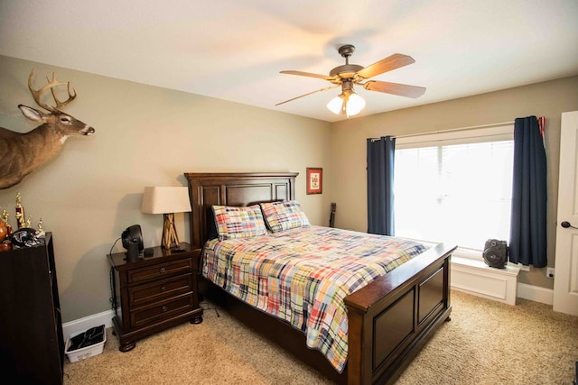 bedroom featuring ceiling fan and light colored carpet