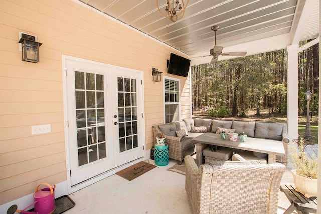 view of patio / terrace with an outdoor living space, ceiling fan, and french doors