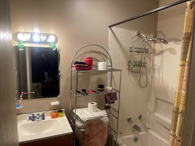 bathroom featuring vanity, bathtub / shower combination, and toilet