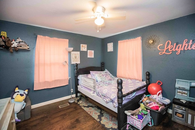 bedroom featuring dark hardwood / wood-style floors and ceiling fan