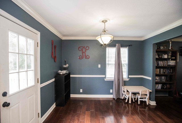 dining space with dark wood-type flooring and ornamental molding