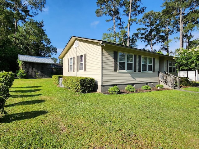 1010 Joree Dr, Thomasville, GA 31792 - view of property exterior with a yard and crawl space