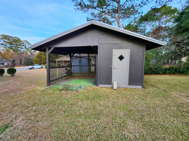 view of outbuilding featuring a lawn