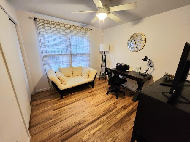 office area with ceiling fan and light hardwood / wood-style floors