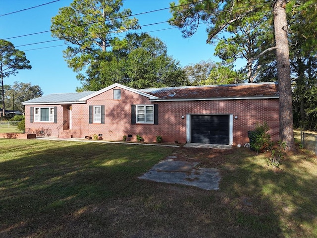 ranch-style house featuring a garage and a front lawn