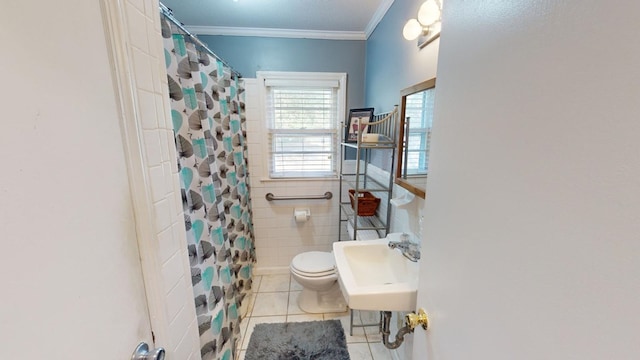 bathroom featuring sink, tile patterned flooring, tile walls, curtained shower, and toilet