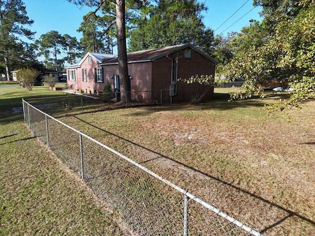 view of home's exterior with a yard