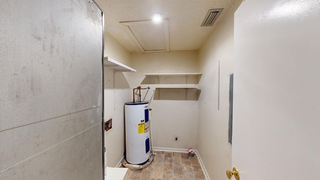 utility room with electric water heater