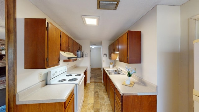 kitchen with electric stove and sink