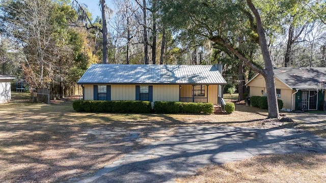 ranch-style home with covered porch